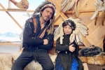 Shah Rukh Khan trolled, Shah Rukh Khan trolled, shah rukh khan and his son abram trolled for sporting native american war bonnets, Trifle