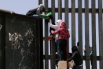 entering US via mexico, punjabi women, video clip shows punjabi women children crossing border fence into u s, Us mexico border