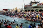 Indians in kumbh mela, varanasi, kumbh mela 2019 indian diaspora takes dip in holy water at sangam, Uttar pradesh chief minister